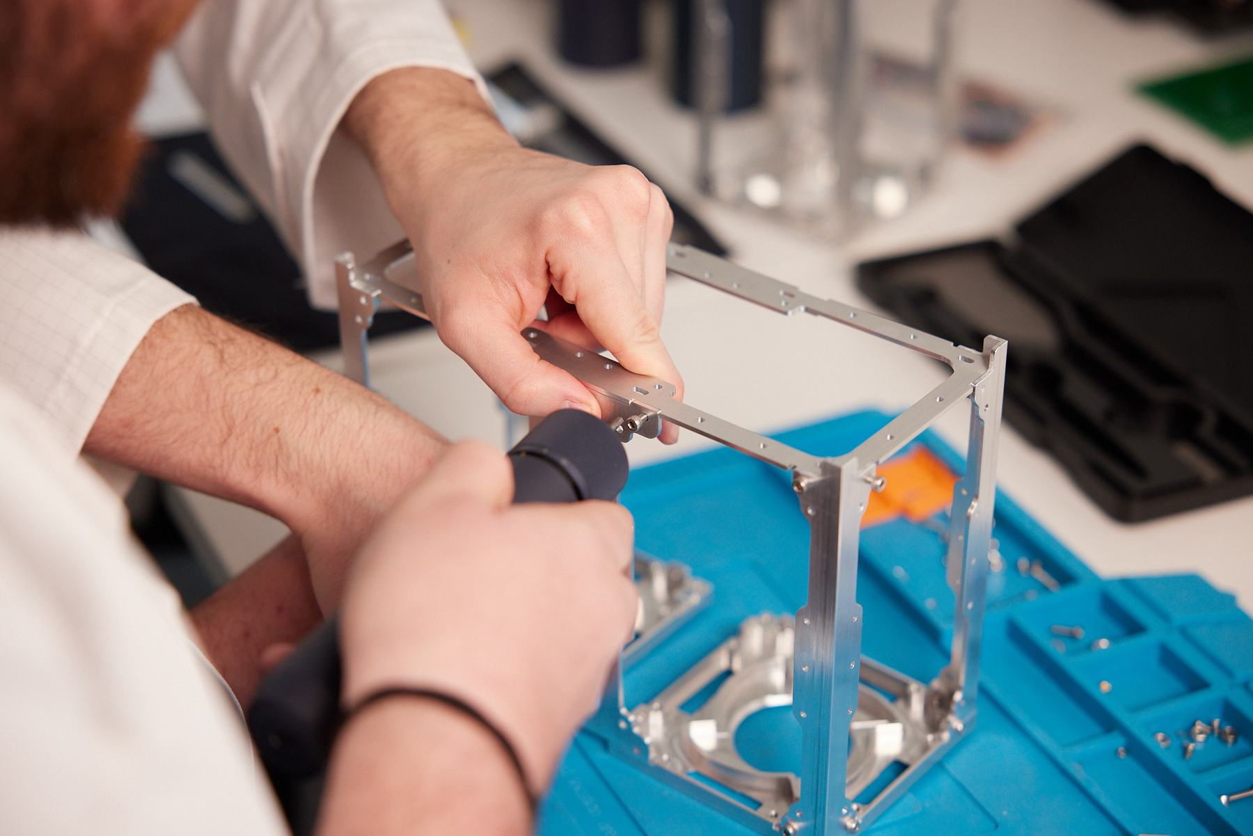 Engineers assembling a SpaceLocker aluminium frame