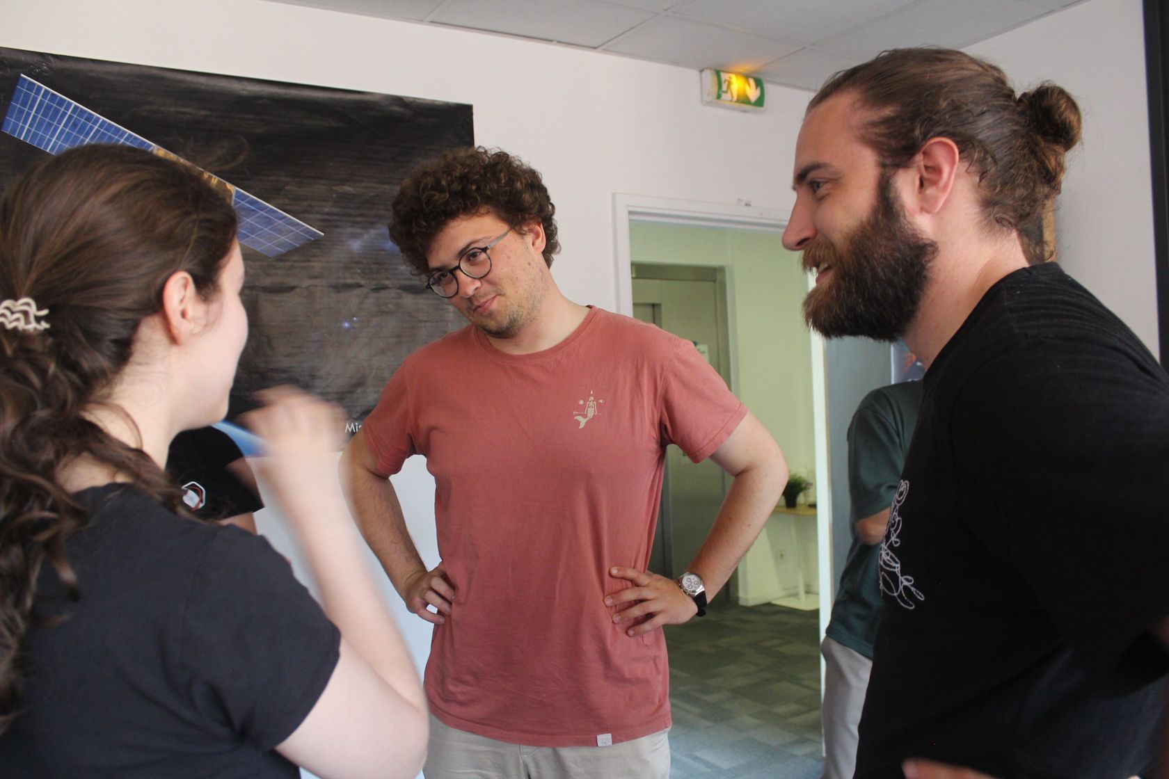SpaceLocker team members chatting in the office